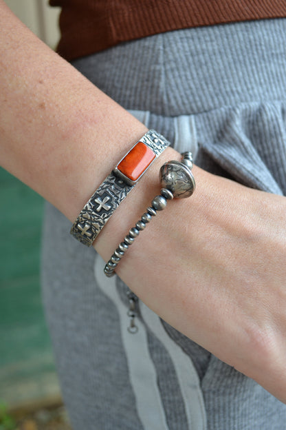 The Eagan | Orange Spiny Cross Cuff by Raymond Coriz