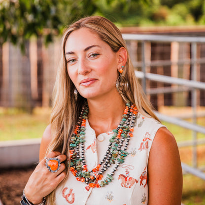 The Canova's | Stamped Orange Spiny Hoops by Leroy James