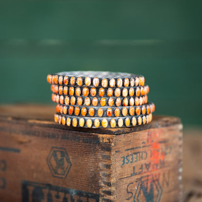 The Phoenix | Orange Spiny Bangles by Charles Johnson