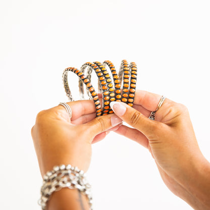 The Phoenix | Orange Spiny Bangles by Charles Johnson