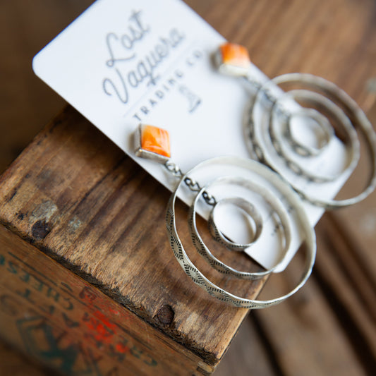 The Canova's | Stamped Orange Spiny Hoops by Leroy James