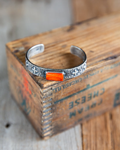 The Eagan | Orange Spiny Cross Cuff by Raymond Coriz