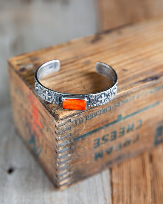 The Eagan | Orange Spiny Cross Cuff by Raymond Coriz