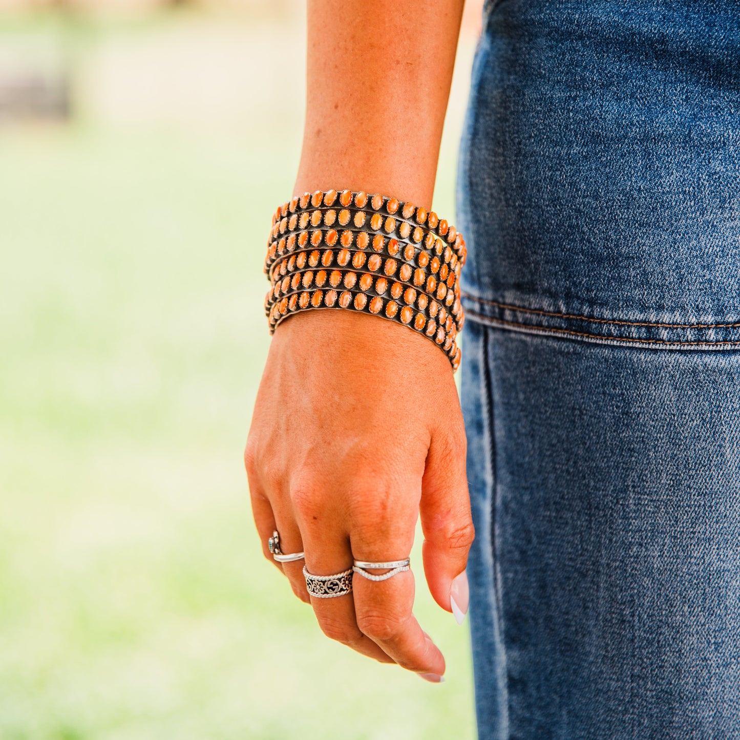 The Phoenix | Orange Spiny Bangles by Charles Johnson