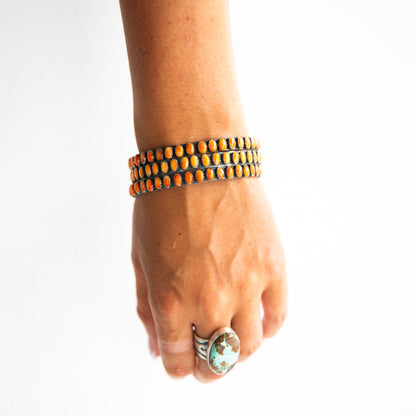 The Phoenix | Orange Spiny Bangles by Charles Johnson