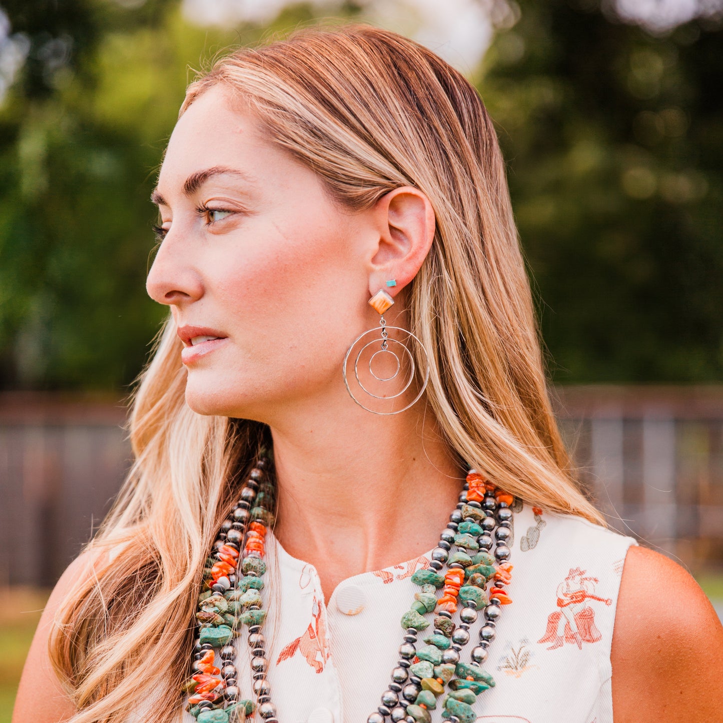 The Canova's | Stamped Orange Spiny Hoops by Leroy James